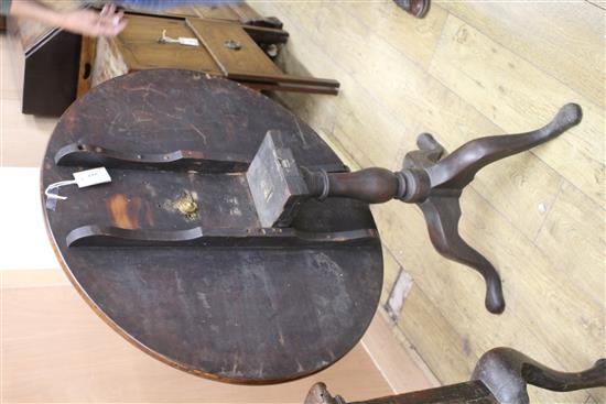 A George III mahogany circular tilt top table on pillar and tripod base, Diameter 84cm, H.71cm